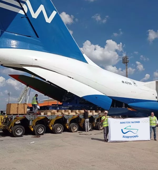 South Wind employees in front of a freight plane 
